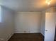 Cozy bedroom featuring laminate floors, neutral walls, and a window for natural light at 24 Pine St, Franklinton, NC 27525
