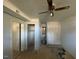 Bright bedroom featuring ceiling fan, neutral walls, and an open closet space for easy organization at 24 Pine St, Franklinton, NC 27525