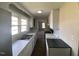 Traditional kitchen design with white cabinets and countertops plus a view to the living room at 24 Pine St, Franklinton, NC 27525