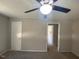 Cozy living room with a ceiling fan and neutral-toned walls at 24 Pine St, Franklinton, NC 27525