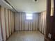 Bright room with a small window and a partially finished wall, ready for customization at 24 Pine St, Franklinton, NC 27525