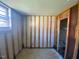 Empty room ready for renovation, featuring exposed beams and a bright window at 24 Pine St, Franklinton, NC 27525