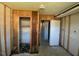 Room featuring exposed beams, doorway, and an open closet space for storage and customization at 24 Pine St, Franklinton, NC 27525