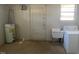 Utility room featuring a washer, utility sink and water heater at 24 Pine St, Franklinton, NC 27525