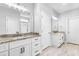 Bathroom featuring double vanities with granite countertops and modern fixtures at 241 Indigo St, Lillington, NC 27546