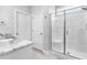 Bathroom featuring a walk-in shower, vanity with granite countertop, and neutral wall color at 241 Indigo St, Lillington, NC 27546