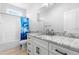 Bathroom featuring a shower with blue curtain, vanity, and neutral wall color at 241 Indigo St, Lillington, NC 27546