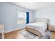 Light-filled bedroom with neutral decor and an area rug at 241 Indigo St, Lillington, NC 27546