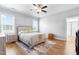 Neutral bedroom featuring a ceiling fan, natural light, and an area rug at 241 Indigo St, Lillington, NC 27546