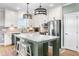 Stylish kitchen with stainless steel appliances, a large island, and elegant pendant lighting at 241 Indigo St, Lillington, NC 27546