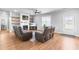 Comfortable living room features plush seating, a fireplace, and access to the backyard at 241 Indigo St, Lillington, NC 27546