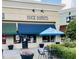 Exterior shot of Duck Donuts featuring an open storefront and patio seating at 3000 Eden Harbor Ct, Raleigh, NC 27613