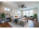 Bright main bedroom with large windows, a ceiling fan, and neutral decor at 3000 Eden Harbor Ct, Raleigh, NC 27613