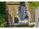 Aerial view showcasing the backyard with in-ground pool, detached garage, and green lawn space at 3001 Greystone Dr, Rocky Mount, NC 27804