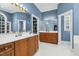 Spacious primary bathroom featuring double vanities, linen closet, and white tiled floors at 3001 Greystone Dr, Rocky Mount, NC 27804