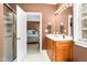 Bathroom with a glass shower and a wood vanity cabinet at 3001 Greystone Dr, Rocky Mount, NC 27804