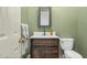Charming powder room with a dark wood vanity, white countertop, and stylish mirror at 3001 Greystone Dr, Rocky Mount, NC 27804