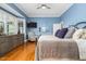 Comfortable bedroom with hardwood floors, bay window, and accent wall at 3001 Greystone Dr, Rocky Mount, NC 27804