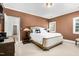 Bedroom with white linens and carpet, a decorative headboard, and a side table at 3001 Greystone Dr, Rocky Mount, NC 27804
