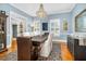 Elegant dining room with stylish light fixture, and large windows for ample natural light at 3001 Greystone Dr, Rocky Mount, NC 27804