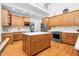 Bright and airy kitchen with island, stainless appliances, and hardwood floors at 3001 Greystone Dr, Rocky Mount, NC 27804
