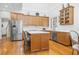 Spacious kitchen with hardwood floors, stainless steel appliances, and a large island at 3001 Greystone Dr, Rocky Mount, NC 27804