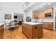 Open-concept kitchen and dining area features hardwood floors and a large kitchen island at 3001 Greystone Dr, Rocky Mount, NC 27804