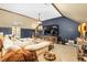 Living room area featuring a large tv, comfortable seating, and stylish decor at 3001 Greystone Dr, Rocky Mount, NC 27804