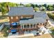 A charming brick home shows a screened in porch and patio, inviting relaxation and outdoor enjoyment at 3001 Greystone Dr, Rocky Mount, NC 27804
