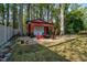Backyard shed featuring gravel, outdoor seating, a fire pit, and privacy fencing at 3001 Greystone Dr, Rocky Mount, NC 27804