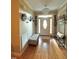 Bright and inviting entryway with hardwood floors, decorative lighting, and stylish decor at 3098 Creek Point Rd, Graham, NC 27253
