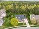 Stunning home situated on a sprawling lot with mature trees, lush landscaping, and a well-manicured lawn at 312 Alliance Cir, Cary, NC 27519