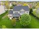 Sprawling home with a large backyard, mature trees, and a patio area, ideal for outdoor living at 312 Alliance Cir, Cary, NC 27519