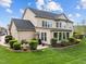 Expansive backyard featuring lush lawn, mature landscaping, and a patio perfect for outdoor entertaining at 312 Alliance Cir, Cary, NC 27519