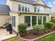 Well-maintained backyard with manicured landscaping surrounding the outdoor living space at 312 Alliance Cir, Cary, NC 27519