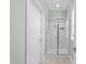 Modern bathroom features tiled floors, glass shower, and neutral paint at 312 Alliance Cir, Cary, NC 27519