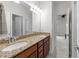 This full bathroom features a double sink vanity with granite counters and modern fixtures at 312 Alliance Cir, Cary, NC 27519