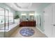 The luxury bathroom boasts a soaking tub, dual vanities, and plenty of light at 312 Alliance Cir, Cary, NC 27519