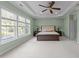 Primary bedroom features tray ceiling, large windows and plush carpet at 312 Alliance Cir, Cary, NC 27519