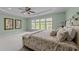 Spacious bedroom features large windows, a ceiling fan and modern decor at 312 Alliance Cir, Cary, NC 27519