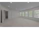 Large bonus room with recessed lighting and a series of windows offering ample natural light at 312 Alliance Cir, Cary, NC 27519