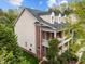 Charming two-story home with a brick facade, a cozy balcony, and well-maintained landscaping at 312 Alliance Cir, Cary, NC 27519