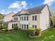 Rear exterior showing well maintained landscaping and a multi paned window exterior view at 312 Alliance Cir, Cary, NC 27519