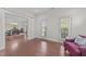 Foyer with hardwood floors and views of the dining room and outdoor access at 312 Alliance Cir, Cary, NC 27519
