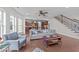 An open living room with hardwood floors, neutral tones, and ample natural light at 312 Alliance Cir, Cary, NC 27519