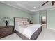Beautiful primary bedroom showcases a ceiling fan, ensuite and luxury furniture at 312 Alliance Cir, Cary, NC 27519
