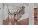 Elegant staircase leading to a spacious living area with lots of natural light at 312 Alliance Cir, Cary, NC 27519