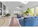 Bright sunroom featuring tile flooring, a ceiling fan, and large windows for plenty of natural light at 312 Alliance Cir, Cary, NC 27519