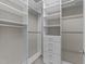 A custom-built walk-in closet features shelving, drawers, and rods for organization at 312 Alliance Cir, Cary, NC 27519