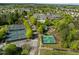 Aerial view of community amenities, featuring tennis courts, and lush landscaping, offering a vibrant lifestyle at 320 Easton Grey Loop, Cary, NC 27519